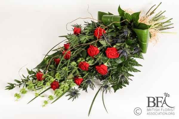 Tied Sheaf Of A Dozen Red Roses